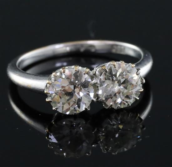 An 18ct white gold and two stone diamond ring, size P/Q.